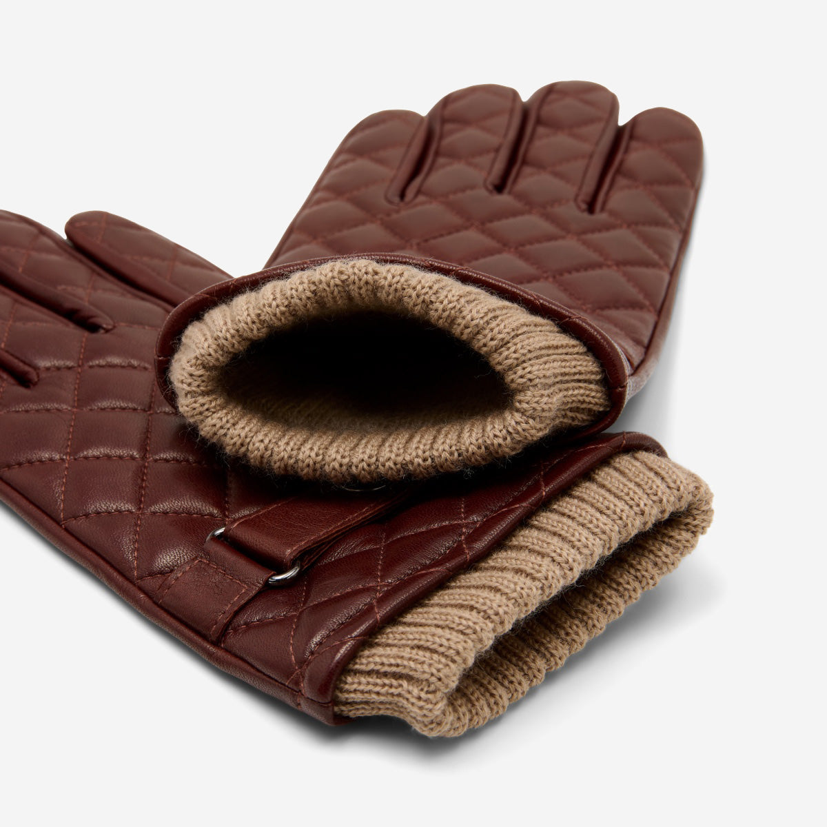 Brown leather gloves with diamond quilting and visible knit cuff lining