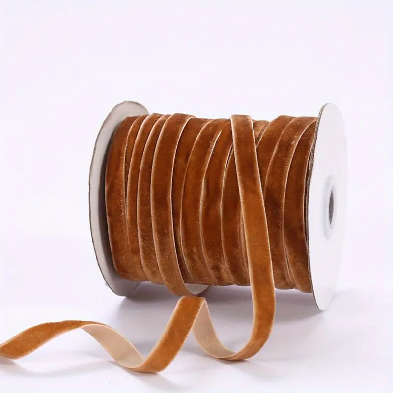 Khaki velvet ribbon on white spool, 3/8 in wide