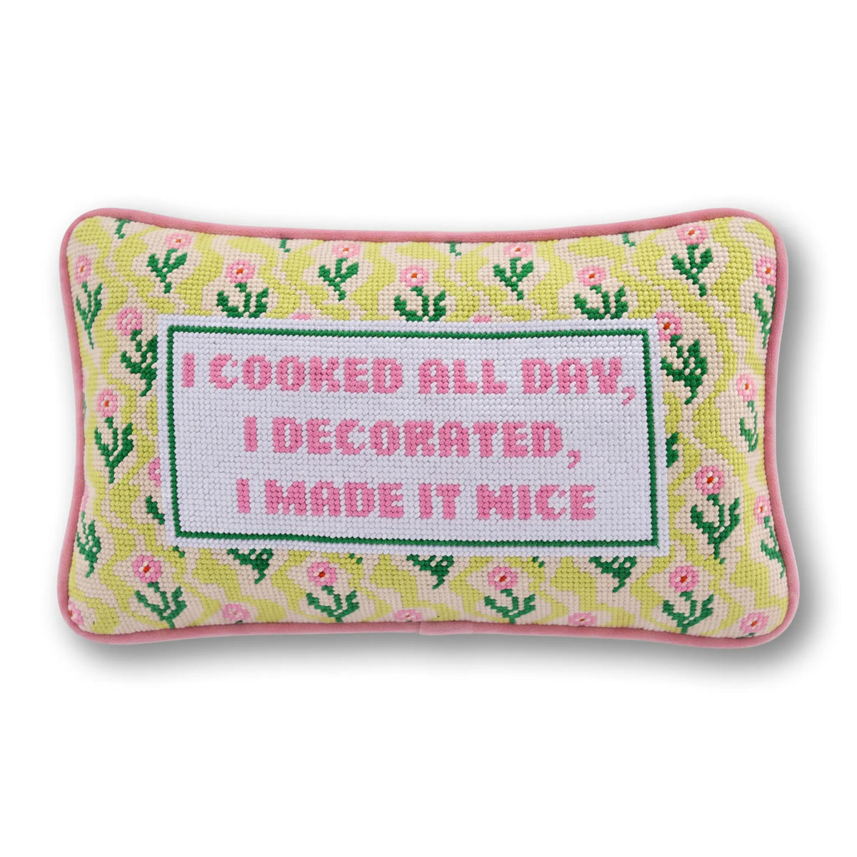 Needlepoint decorative pillow with pink trim and green-yellow pattern, “I made it nice”