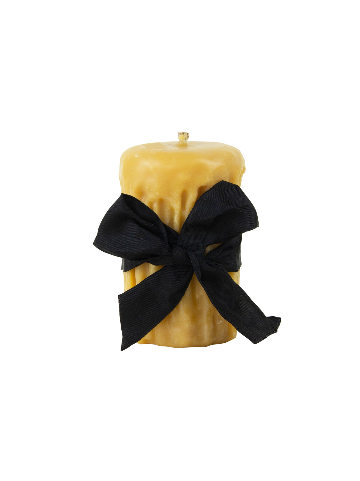 Gold beeswax drip pillar candle with black bow and drips