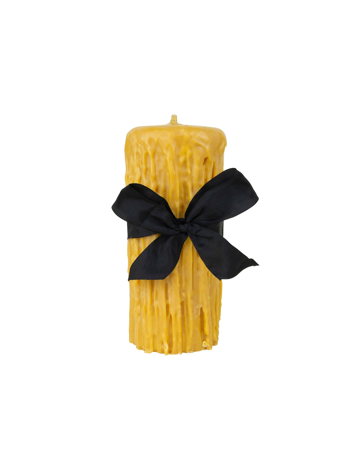 Beeswax drip pillar candle, golden color, with black ribbon bow at center