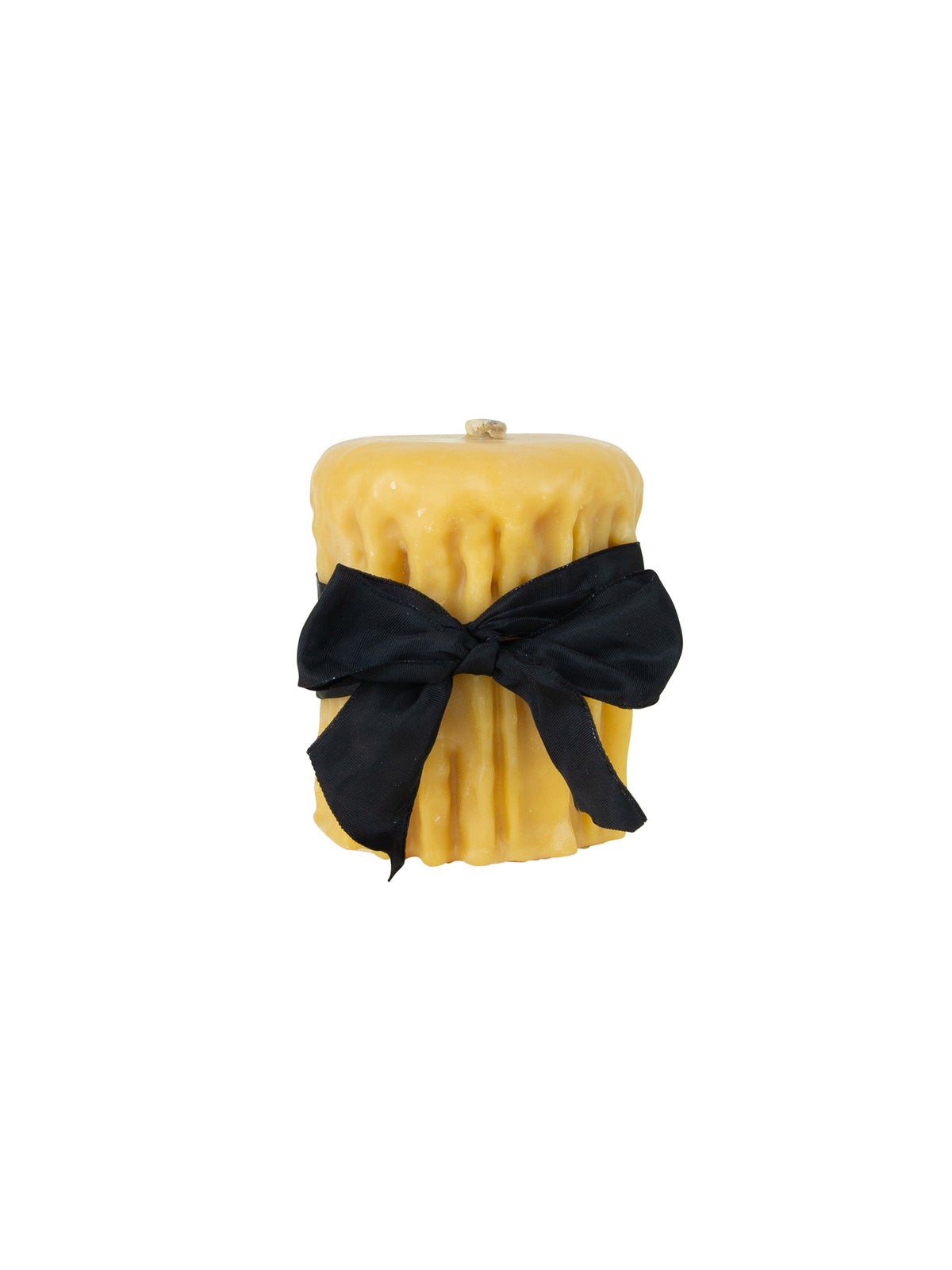 Beeswax drip pillar candle, golden color, wrapped with a black ribbon bow