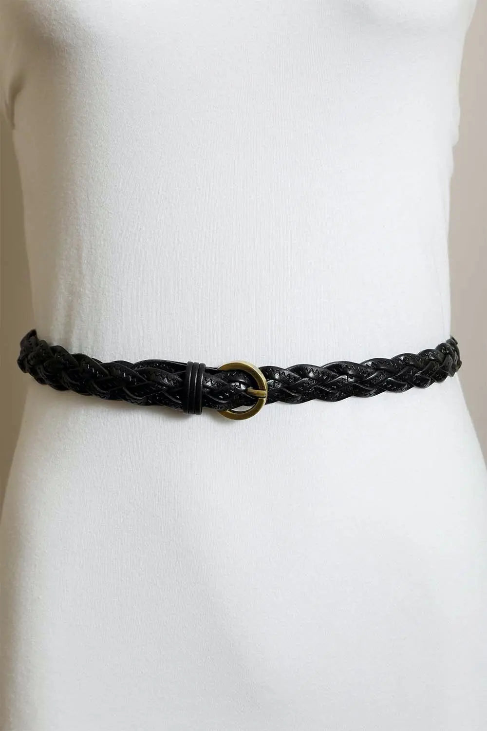 Black braided leather belt with gold round buckle on a waist model