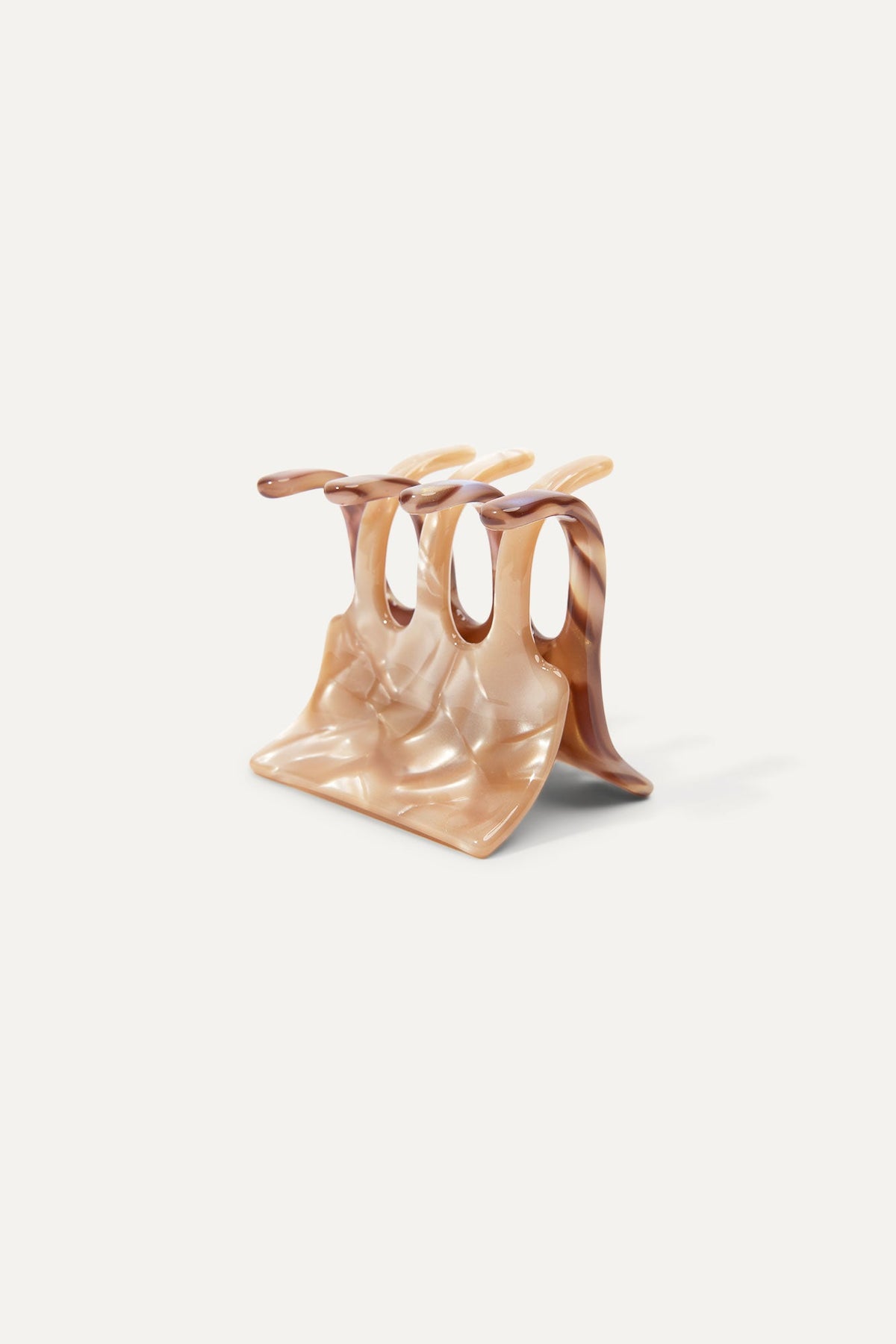 Mini translucent peach hair claw clip with curved base and prongs