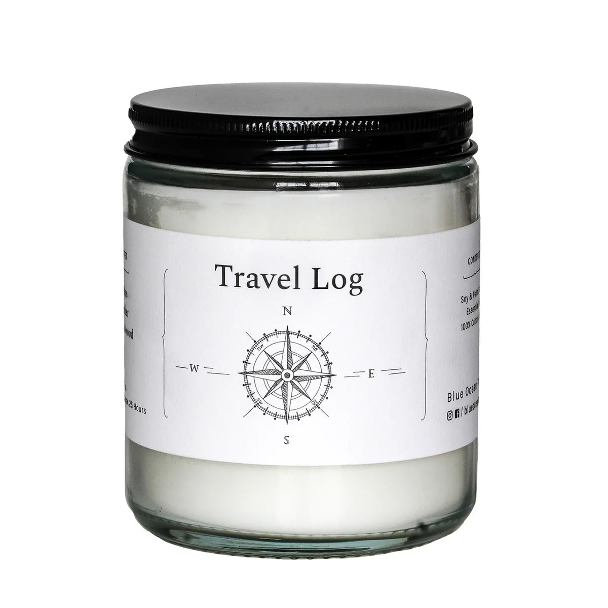Travel Log jar candle in clear glass with black lid and compass label