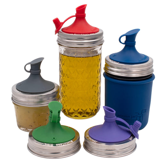 Silicone oil pour lids in red, blue, green, and purple for mason jars with jar bands