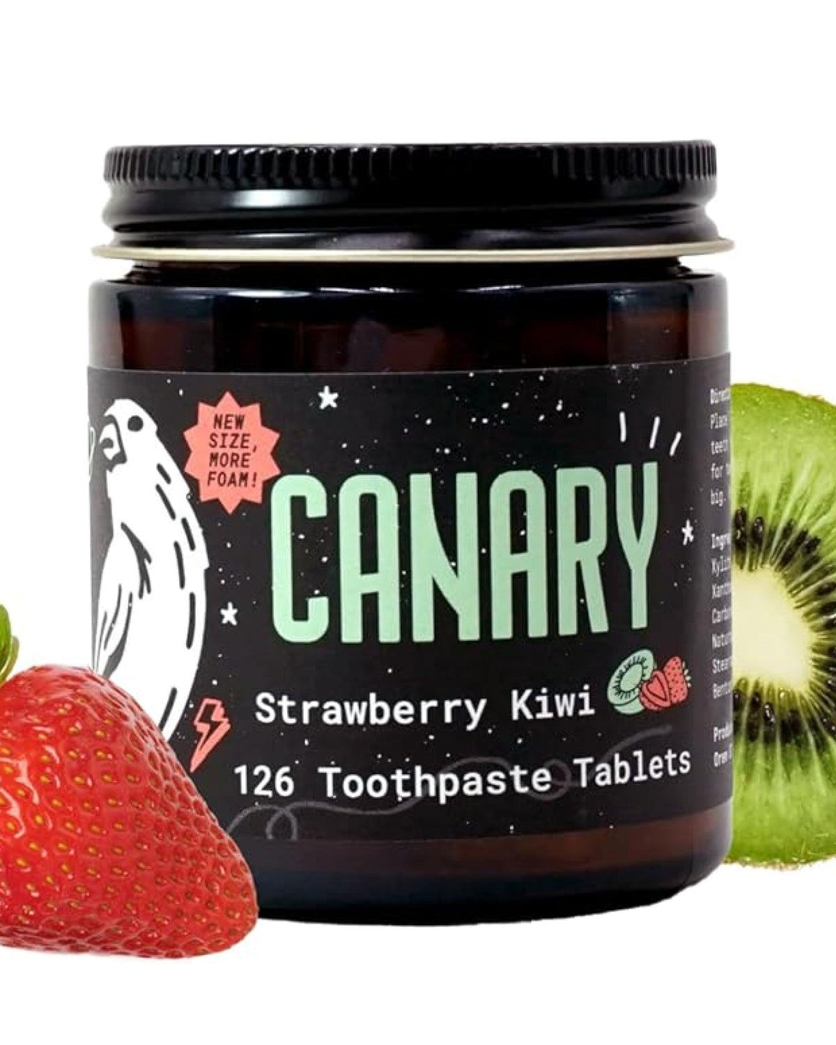 CANARY strawberry kiwi toothpaste tablets in a dark glass jar with strawberry and kiwi