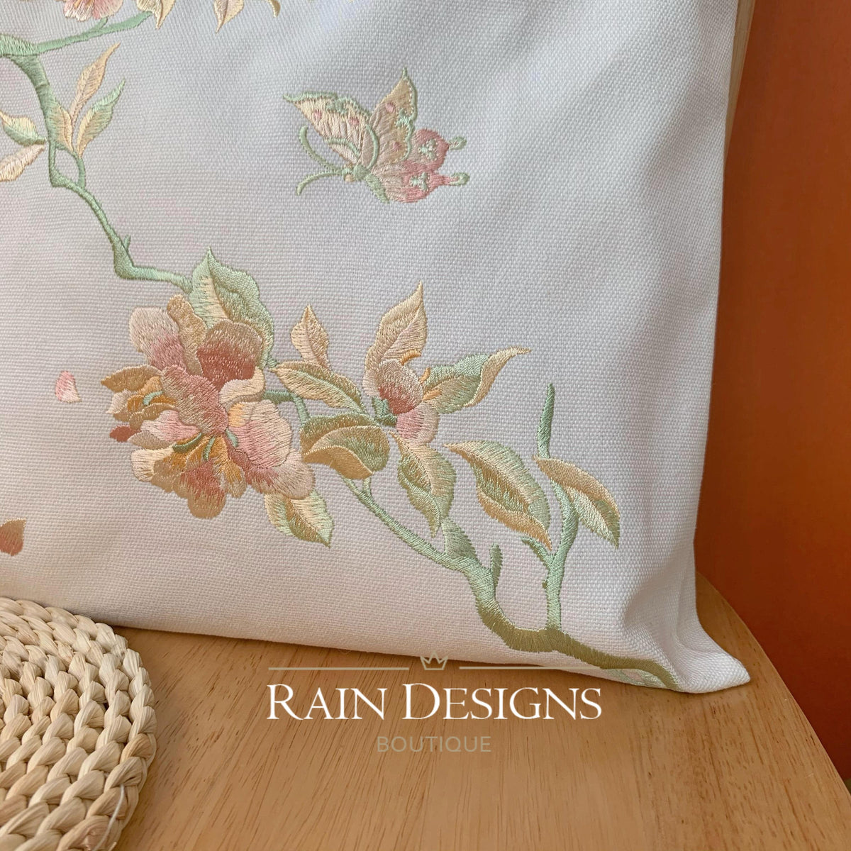 White embroidered tote bag featuring bouquet and bird detail
