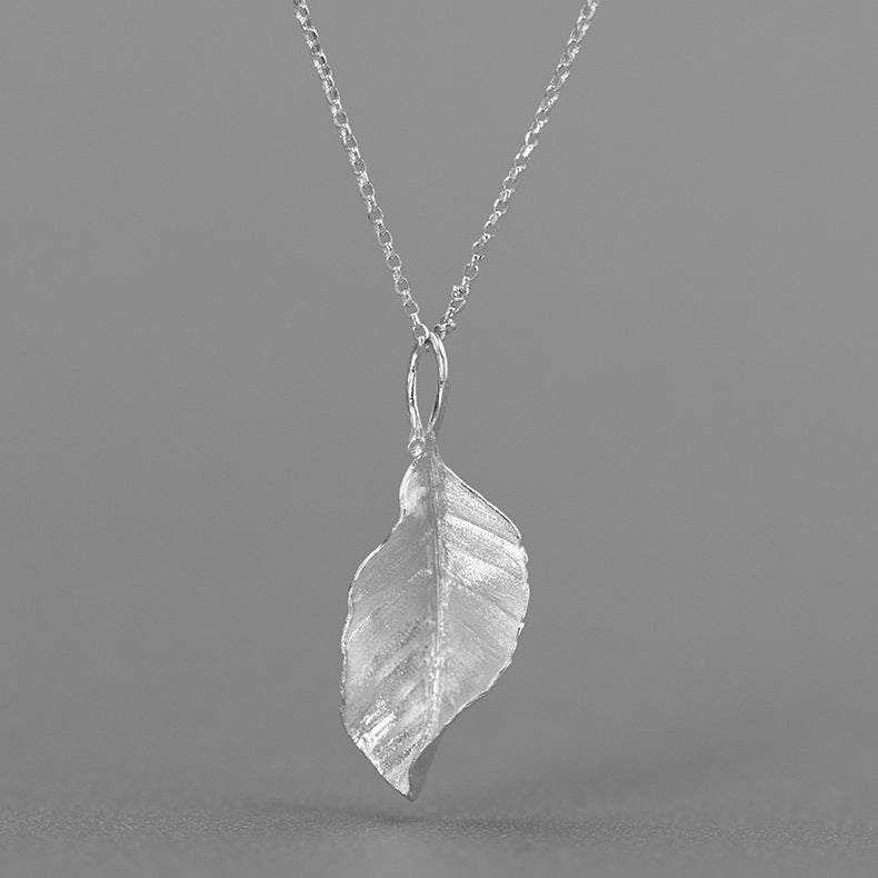 Silver leaf pendant necklace with thin silver chain and teardrop loop clasp