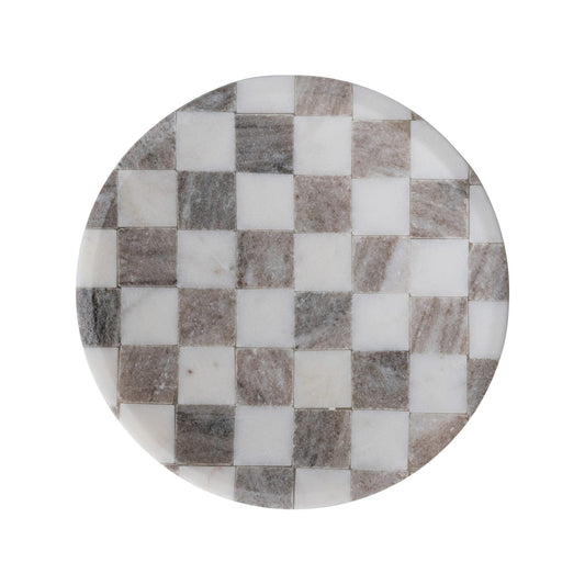 Round marble cheese board with a gray and white checkerboard pattern