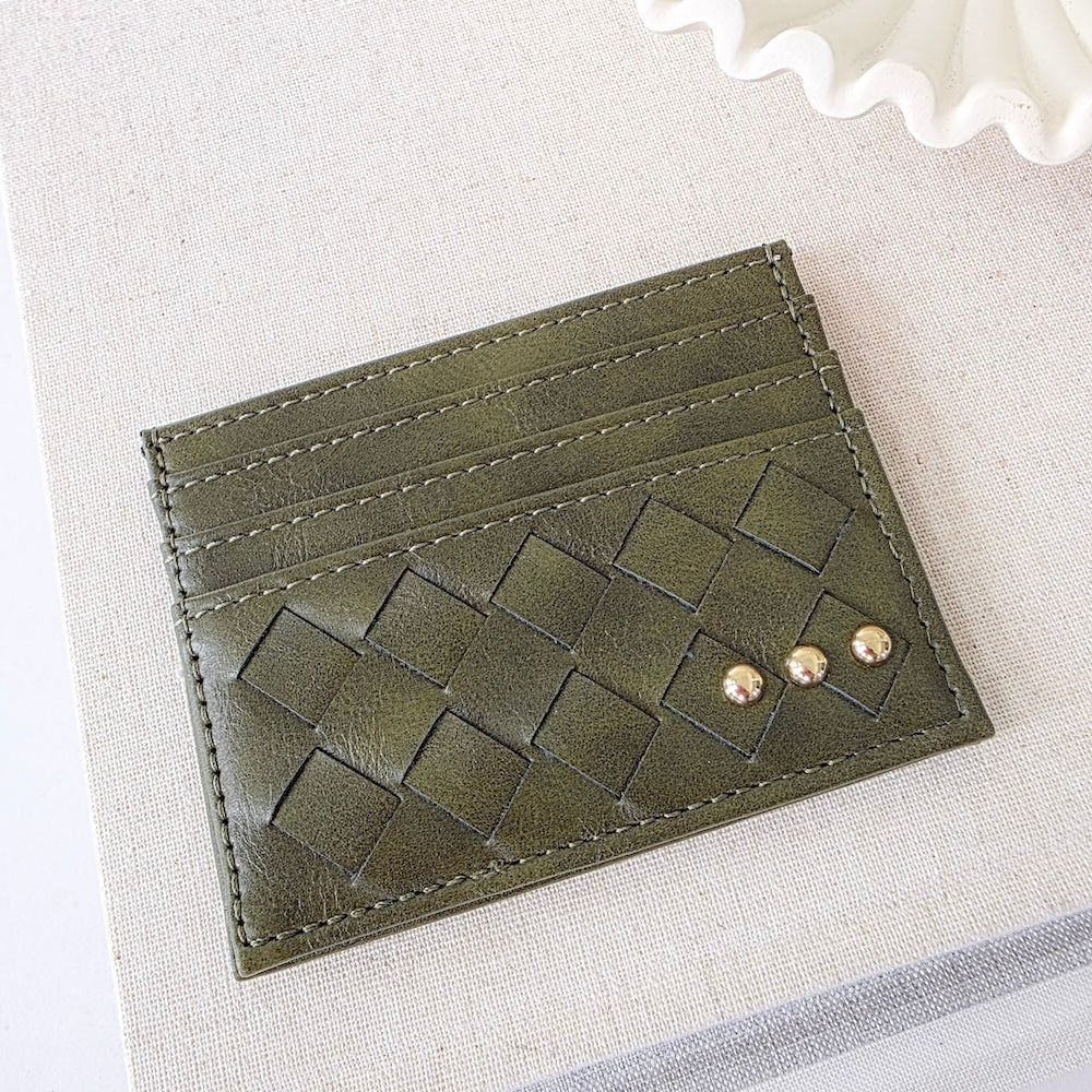 Olive woven small card holder wallet with embossed pattern and gold studs.