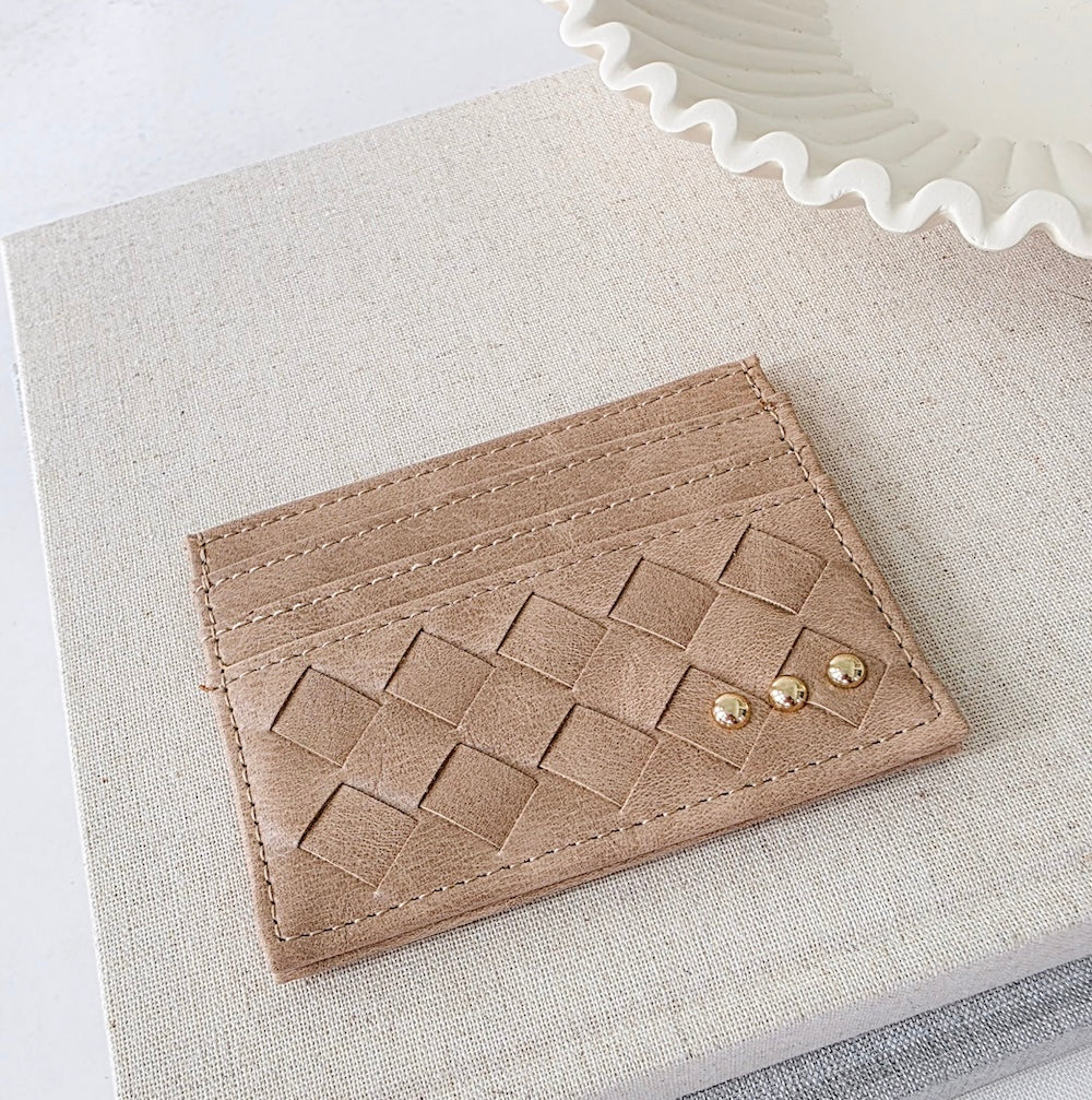 Taupe woven small card holder wallet with embossed pattern and gold studs.