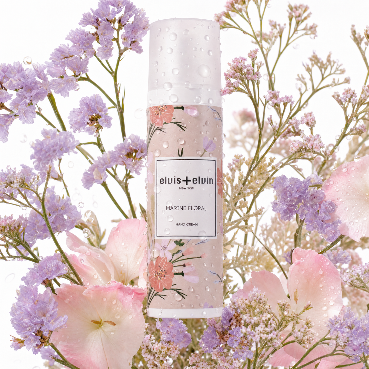 Marine floral hand cream bottle with floral artwork, water droplets, elvis+elvin label