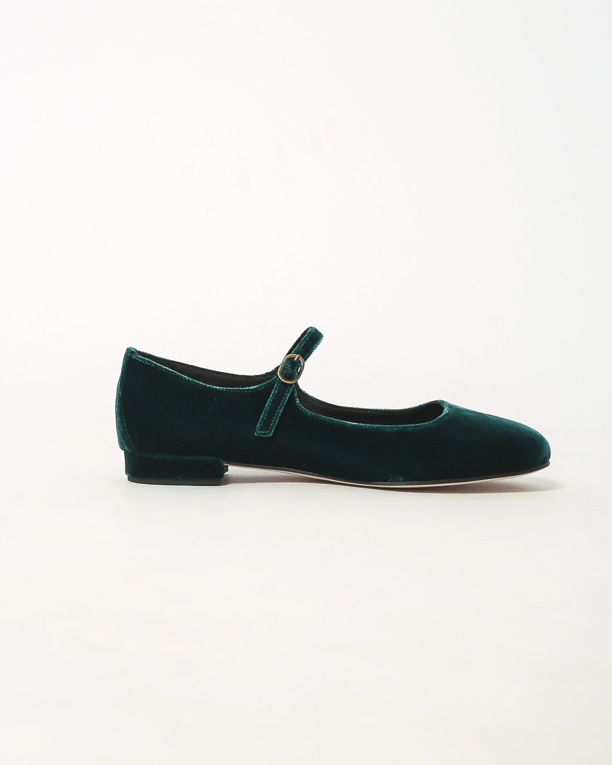 Dark teal velvet Mary Jane flats with oval-buckle strap and low heel