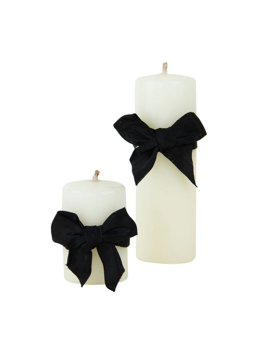 Ivory pillar candles with black bow ribbon, two sizes, smooth wax finish