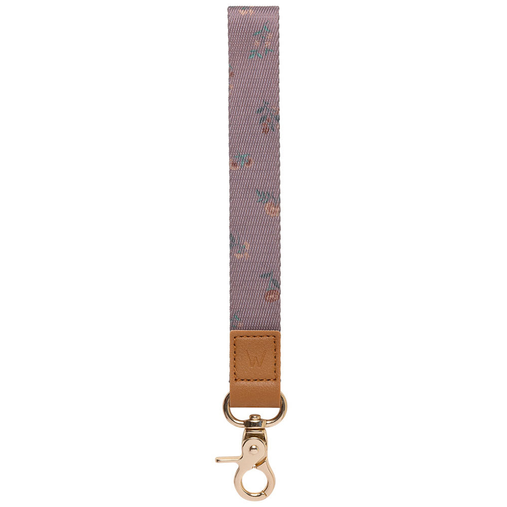Mauve patterned wrist lanyard with tan leather strap and gold metal key clasp