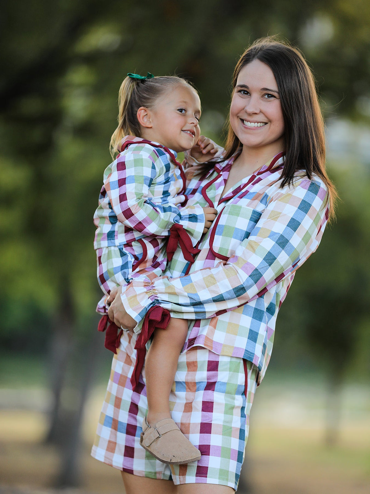 Mom-and-child plaid pajama set, mother holding toddler in long-sleeve button tops