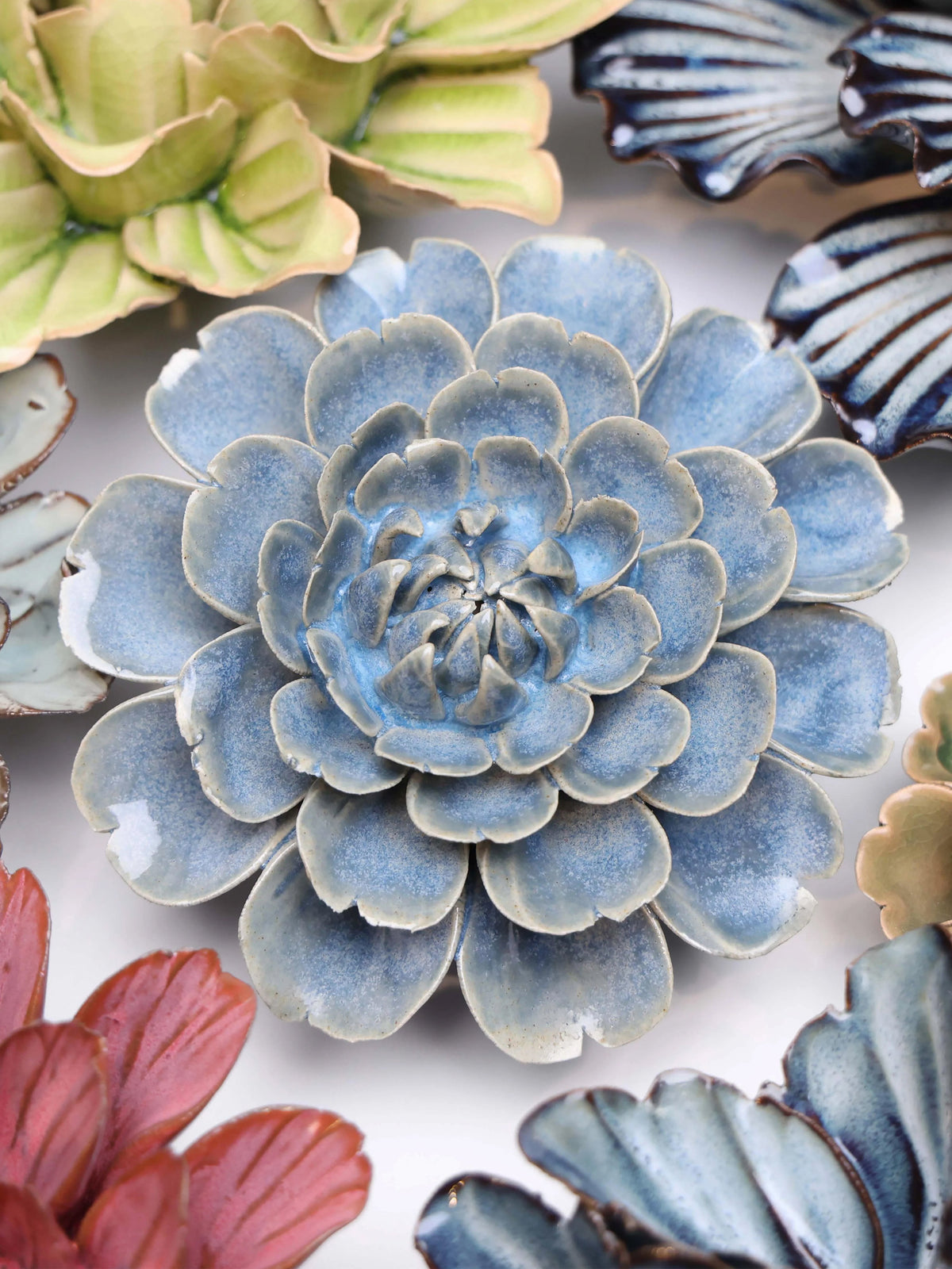 Blue ceramic rose wall decor with layered petal rosettes, medium size