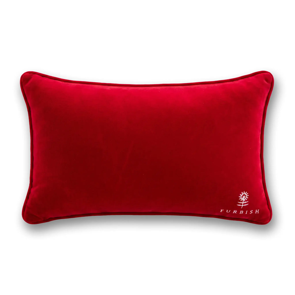Red velvet throw pillow with red piping and small embroidered logo at bottom right