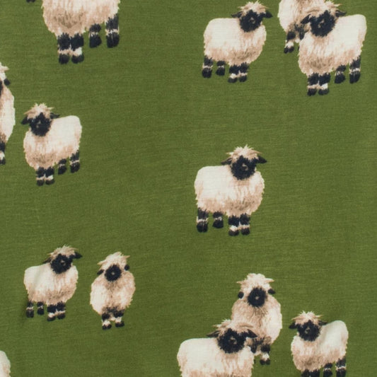 Olive green knit beanie with repeating sheep faces print