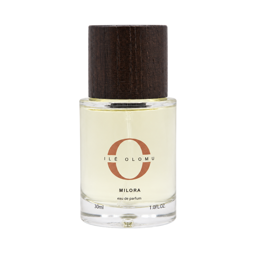 Milora eau de parfum bottle, clear glass with dark wooden cap, 30ml