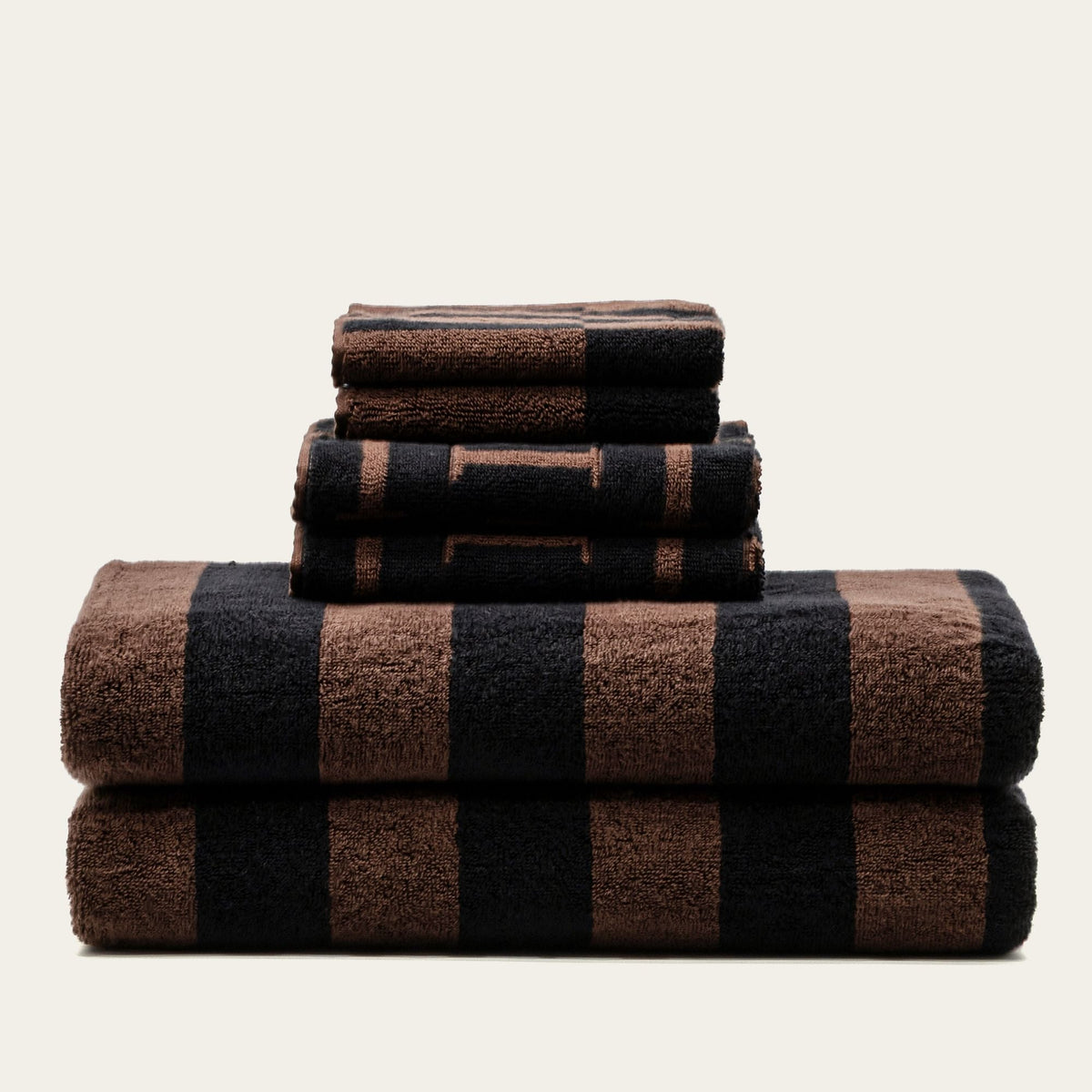 Towel stack in tobacco brown and black plaid, soft cotton bath towels