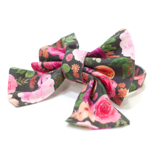 Floral dog collar with pink, green, and dark bow featuring roses and leaves