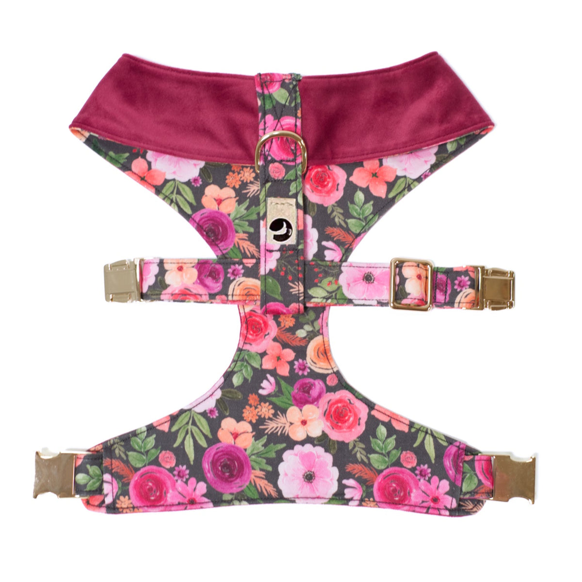 Reversible dog harness with burgundy neckline, floral panel, and gold buckle straps