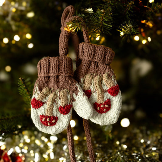 Brown knit mittens with cream mushroom cuffs and red mushroom applique on fingers