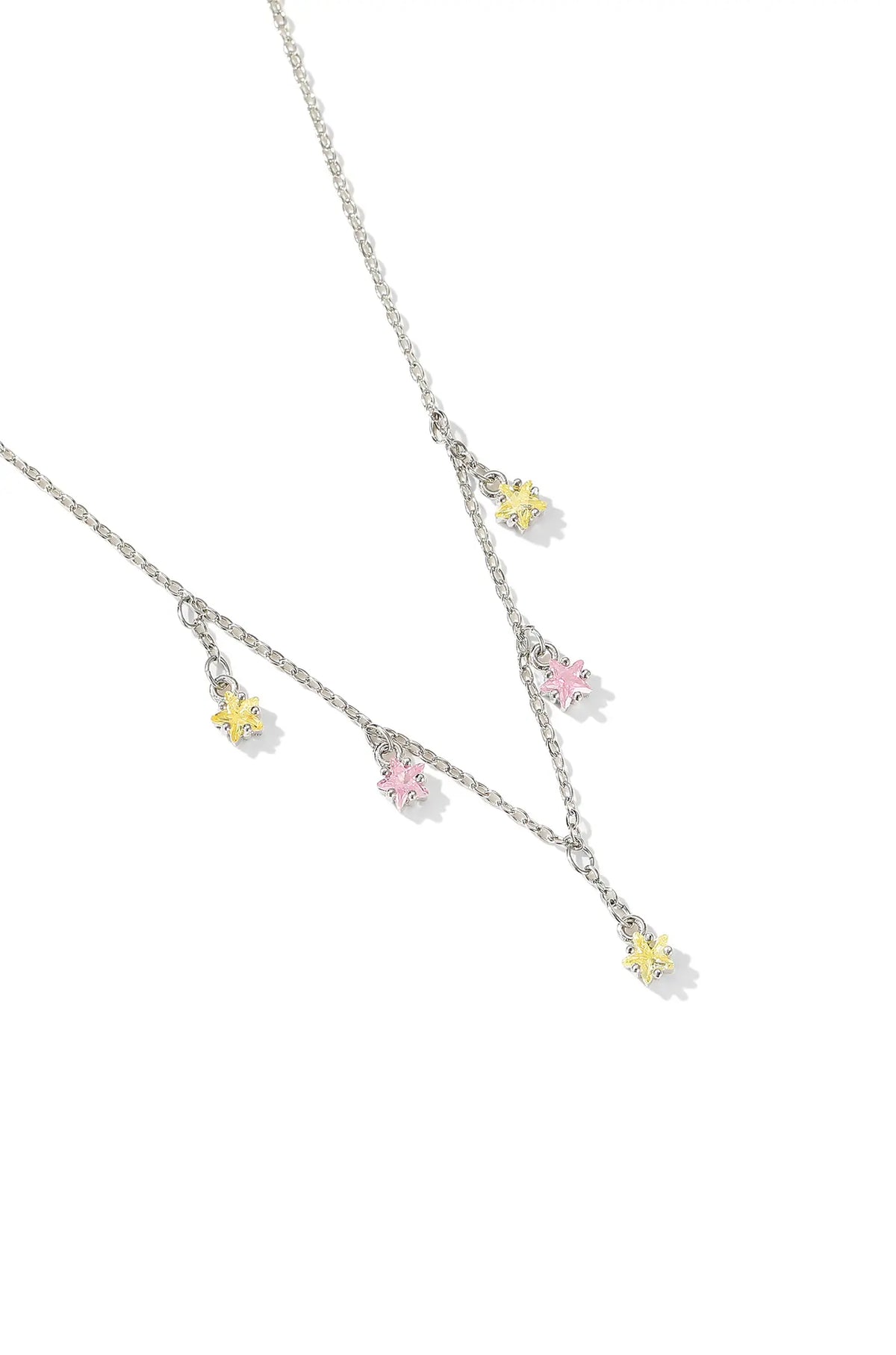 White gold pendant necklace with five small pink and yellow flower charms.