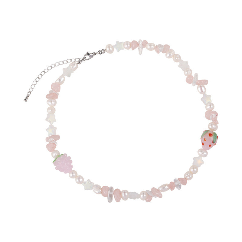 Strawberry necklace with pale pink and white beads, strawberry charms, and an adjustable chain