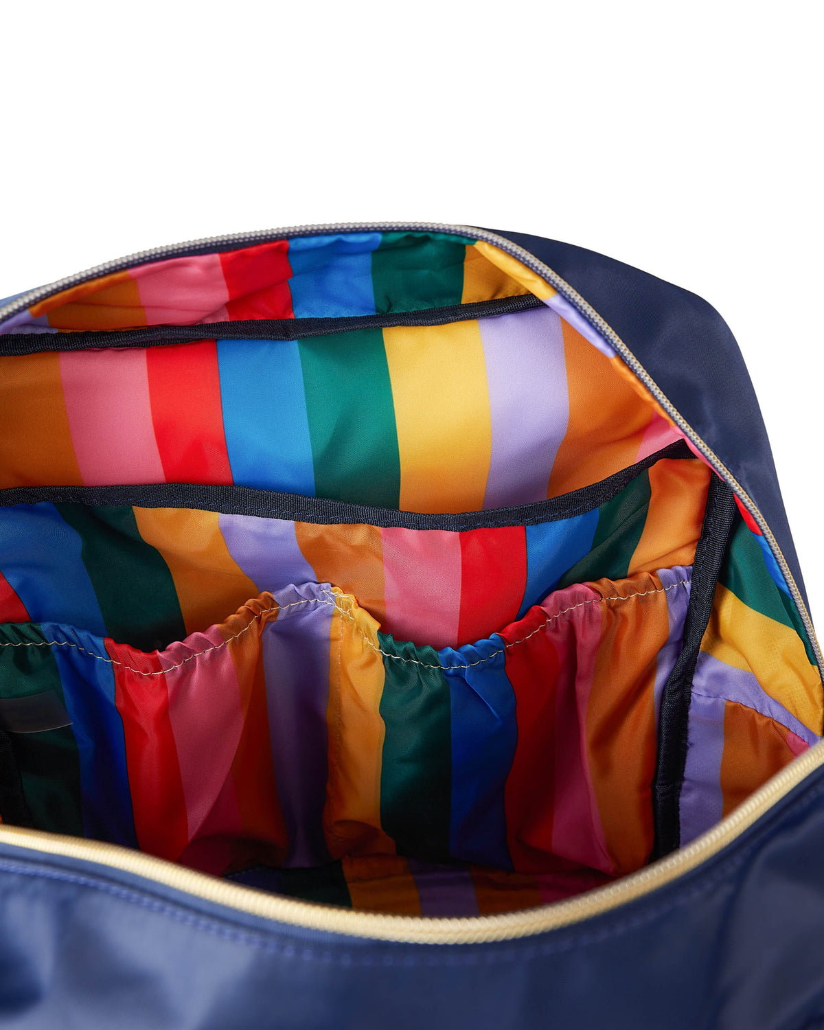 Open navy diaper bag backpack with colorful striped interior lining
