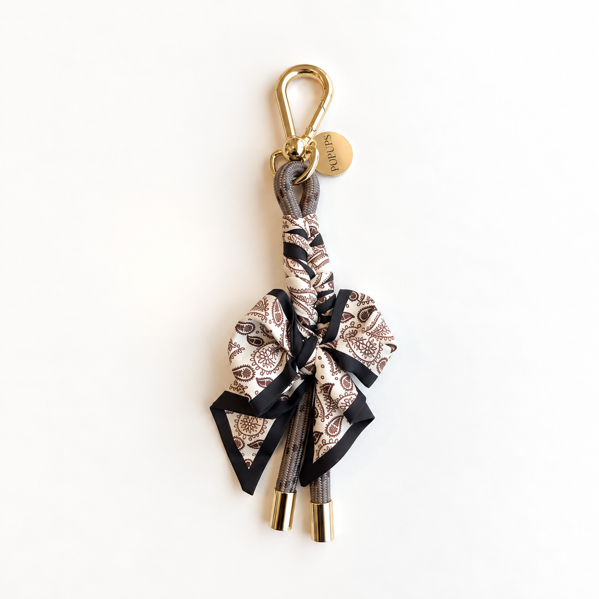 Mocha patterned scarf keychain with gold clasp and ribbon bow