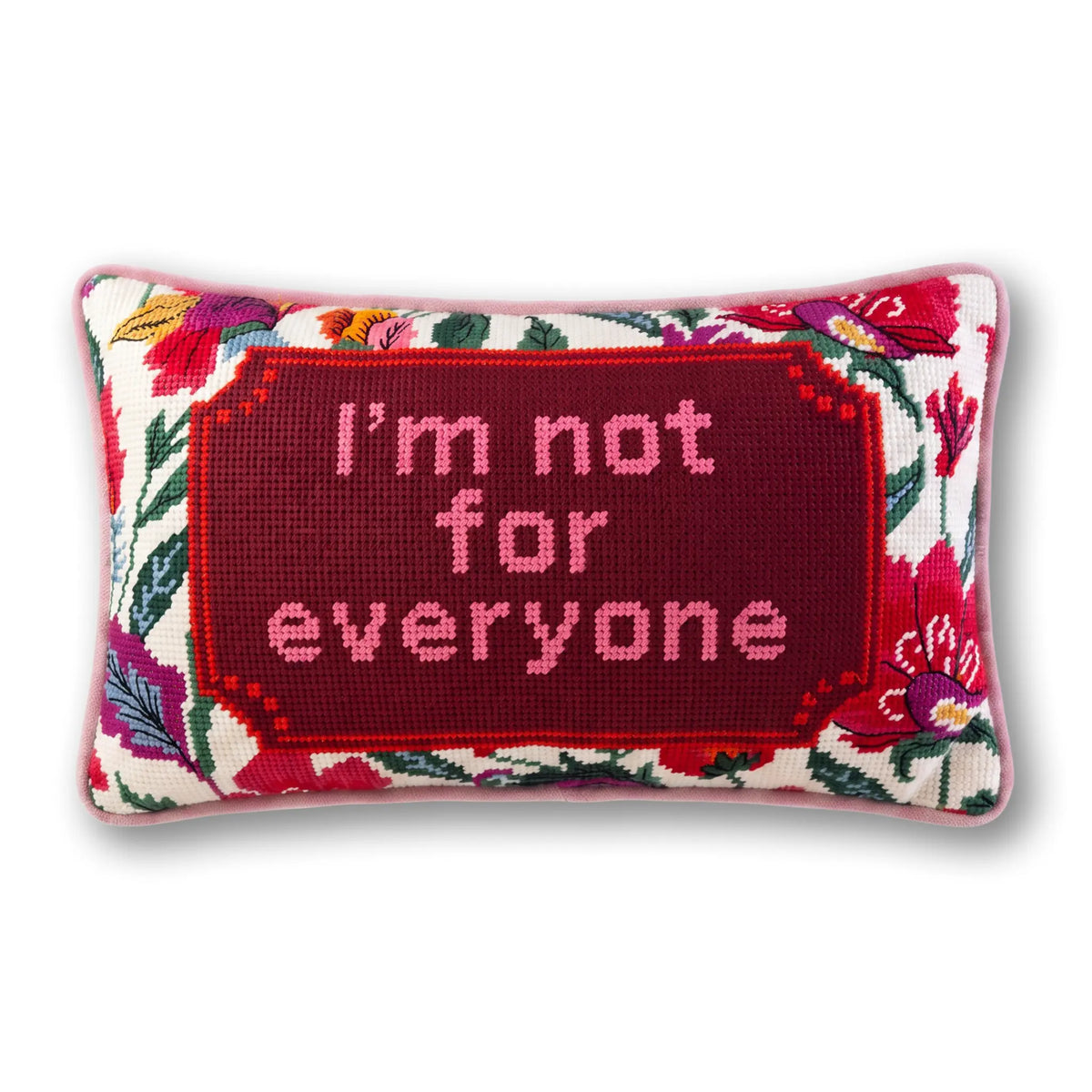 Red needlepoint throw pillow with floral border and text "I'm not for everyone"