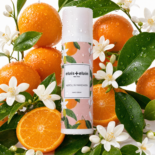 Hand cream bottle with floral citrus label and white cap, elvis+elvin Neroli & Mandarin