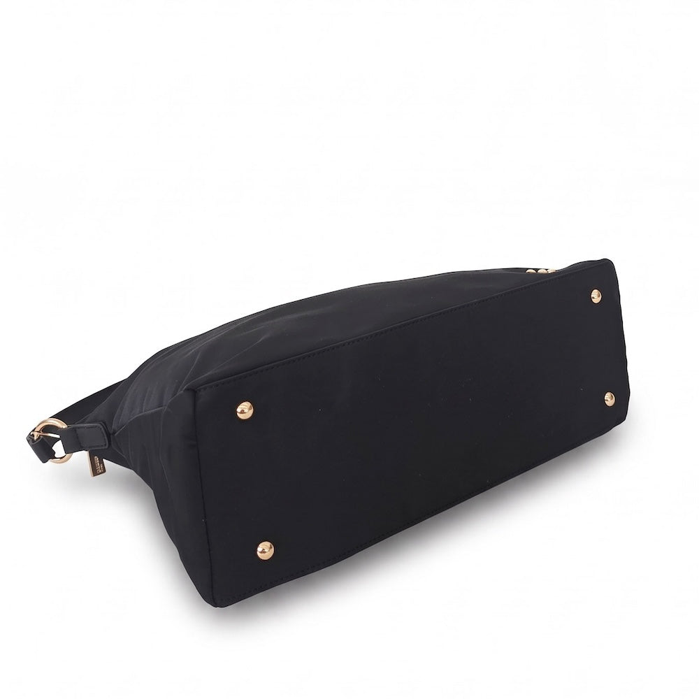 Nikki nylon slouchy shoulder bag in black with gold studs on the side and handle