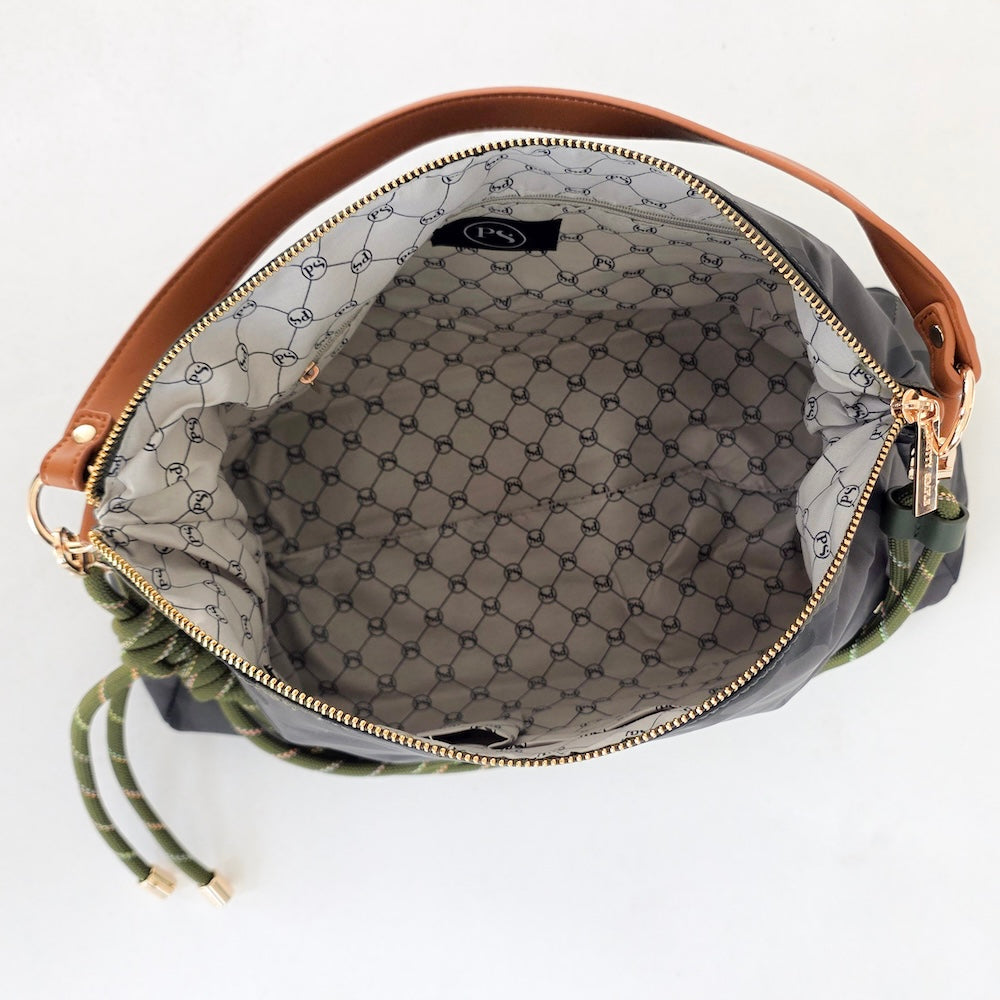 Nikki nylon slouchy shoulder bag interior view with gray geometric lining and zip closure