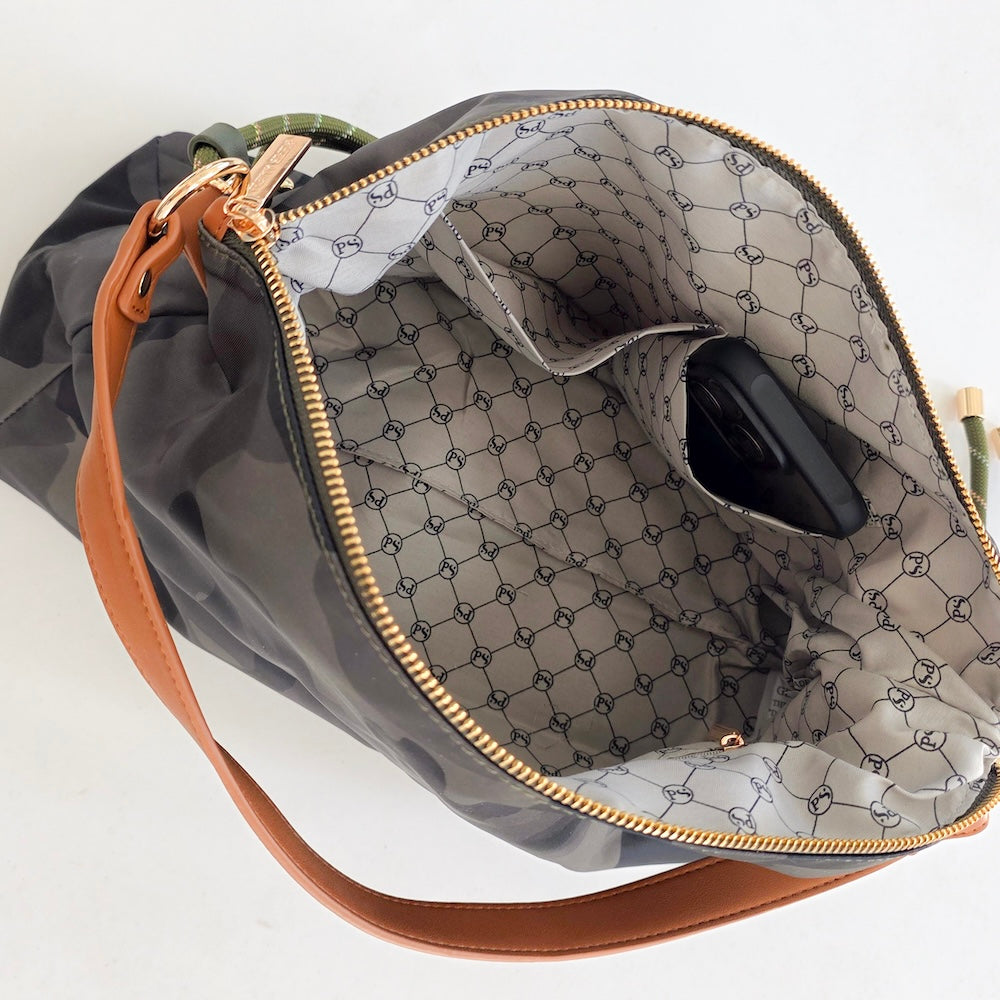 Nikki nylon slouchy shoulder bag interior view with patterned lining and zip pocket