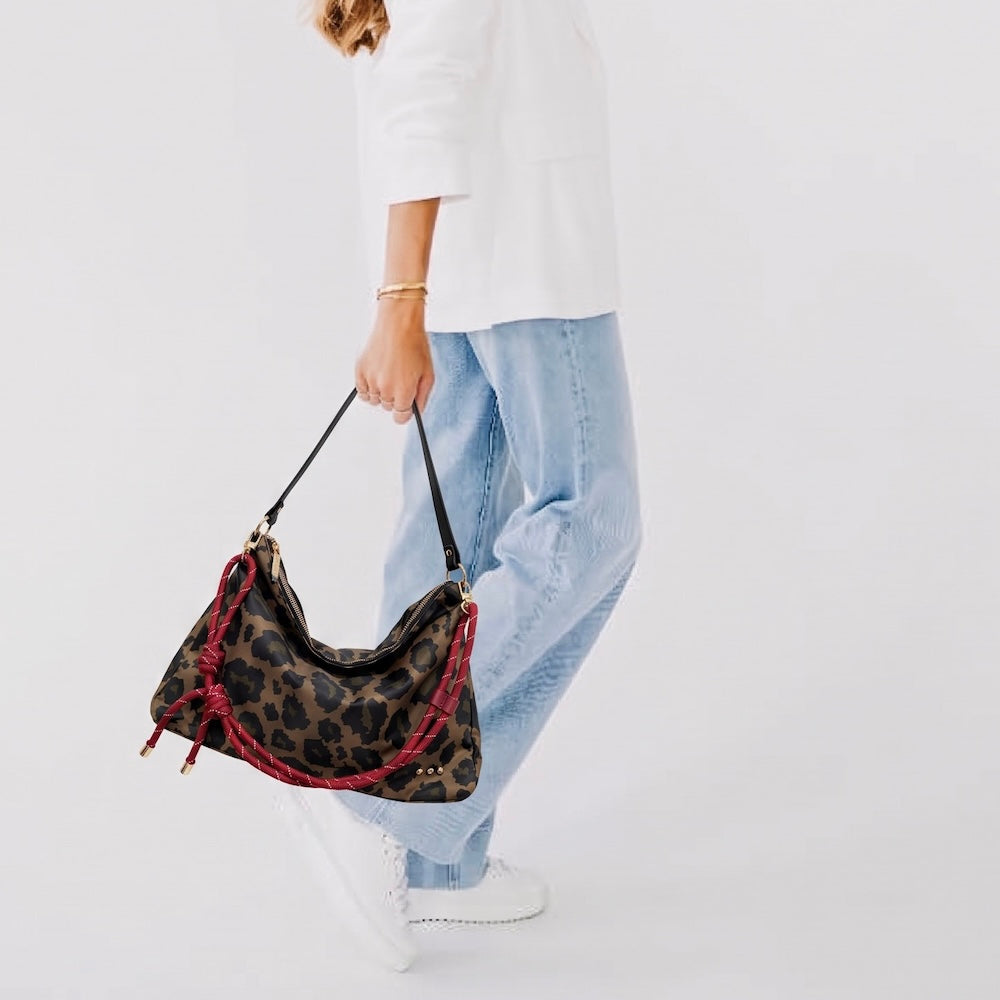 Leopard print nylon slouchy shoulder bag with red rope trim and gold hardware