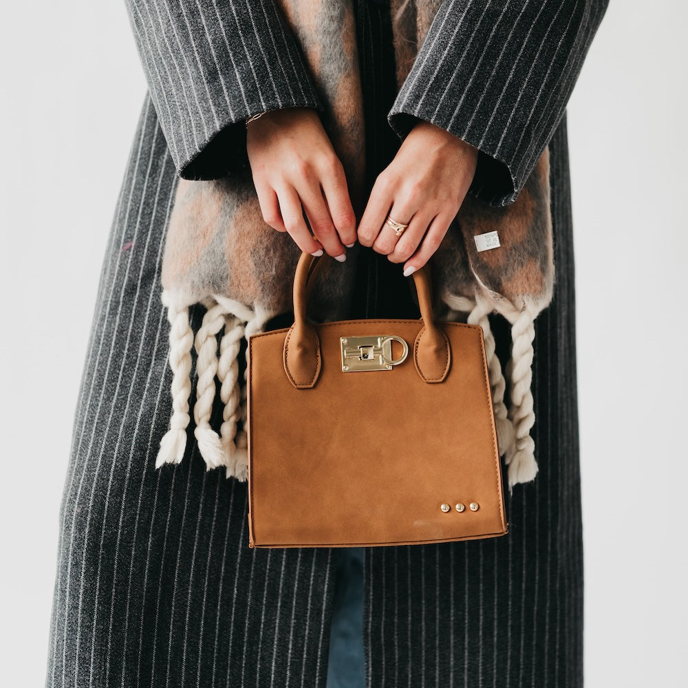 Camel suede small tote bag with buckle clasp and three-dot stud accents