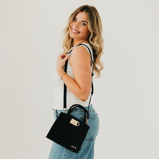 Small suede tote bag in black with top handles and shoulder strap