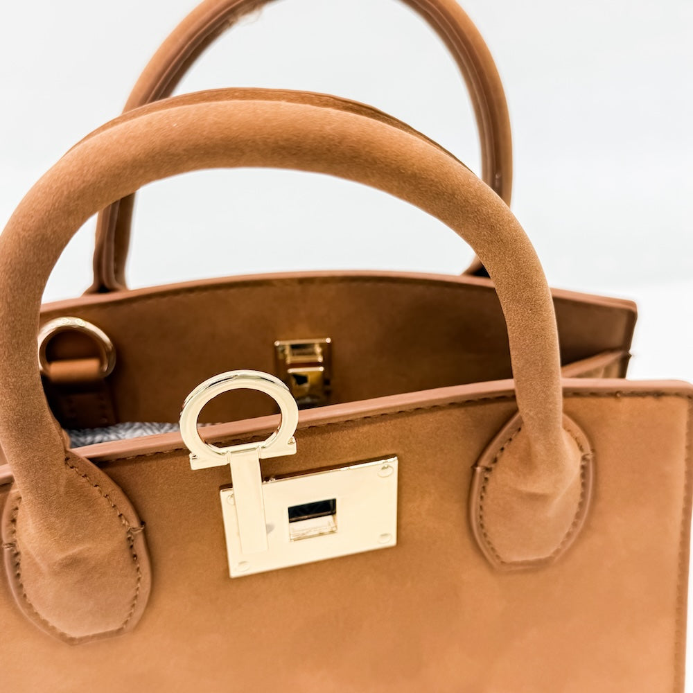 Tan suede tote bag top with gold buckle hardware and loop handle