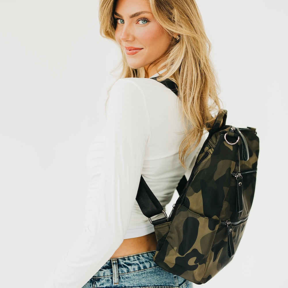 Nylon backpack purse with camouflage print, side view with adjustable shoulder straps