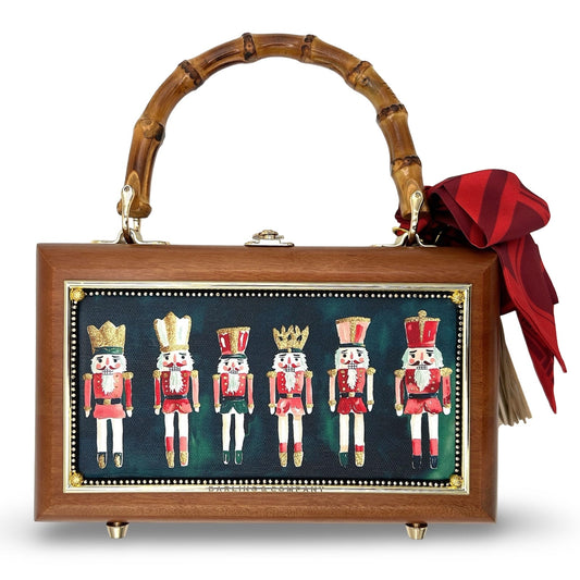 Nutcracker-themed wooden handbag with bamboo handle, nutcracker print panel, red bow
