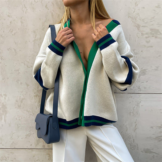 Cream button-front cardigan with green placket and navy striped cuffs and hem