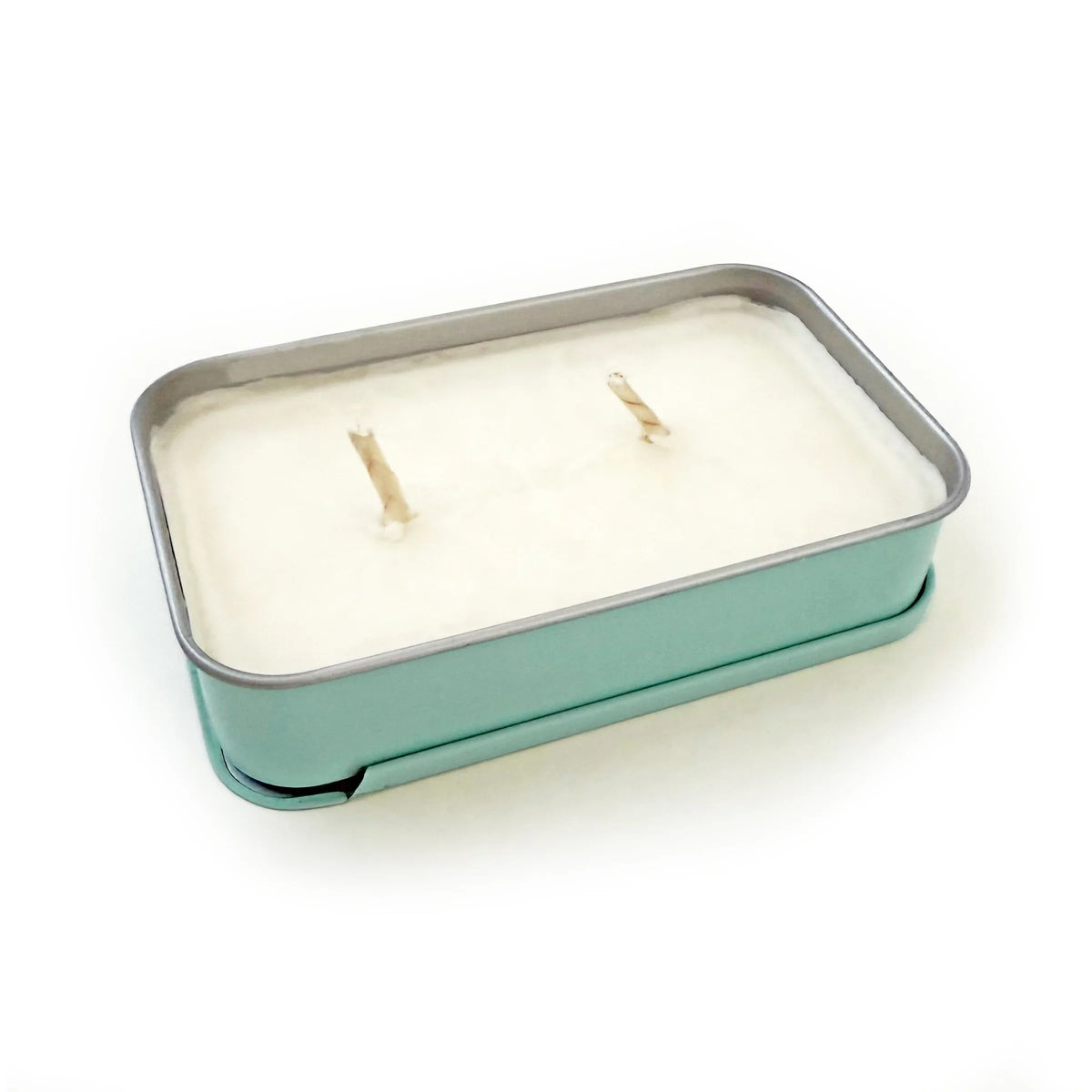 Soy wax candle in teal metal tin with three wicks, top view