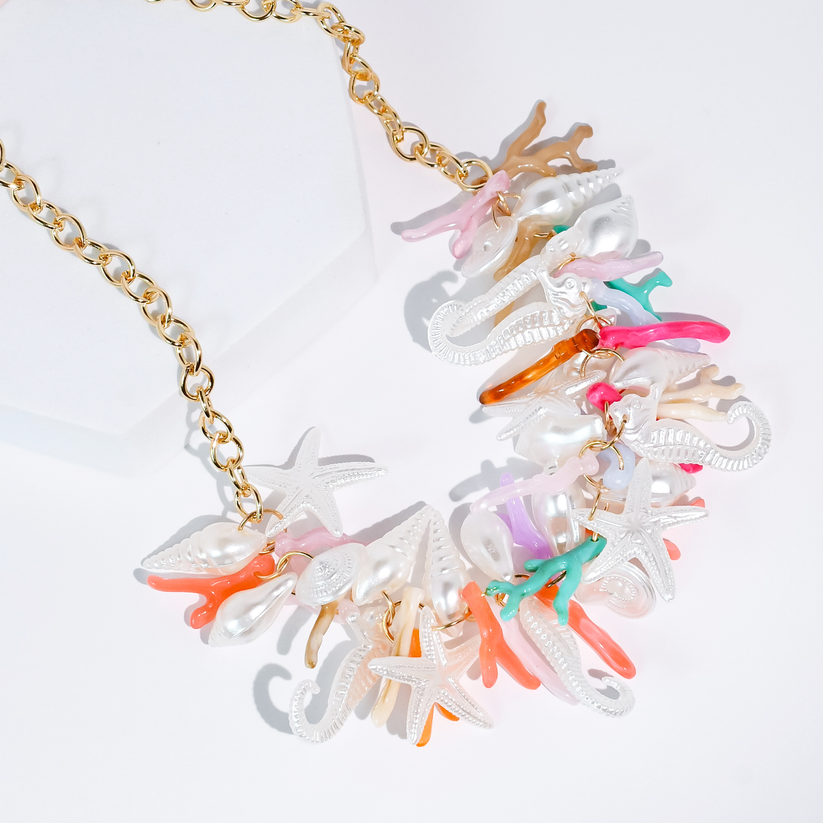 Gold chain necklace with colorful seashell and starfish charms