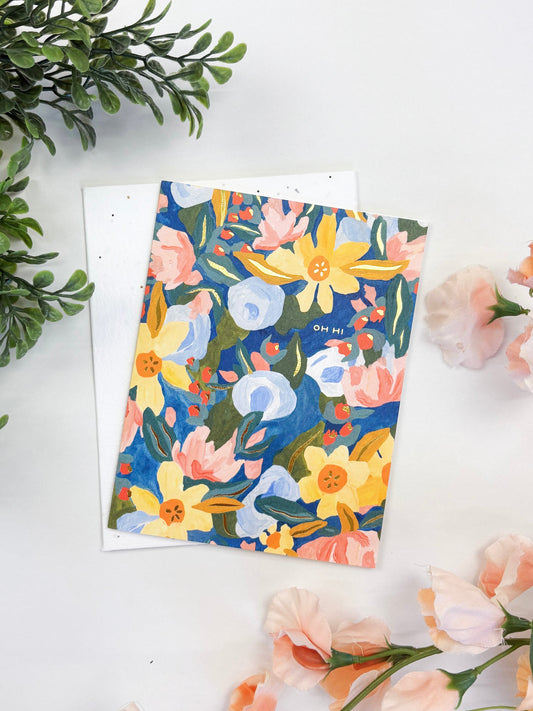 Seeded greeting card with colorful floral illustration on a blank white envelope
