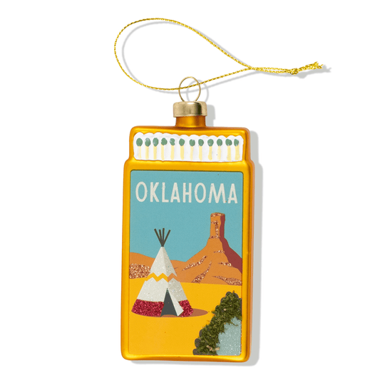 Oklahoma matchbook ornament with illustrated scene, OKLAHOMA text, hanging cord.