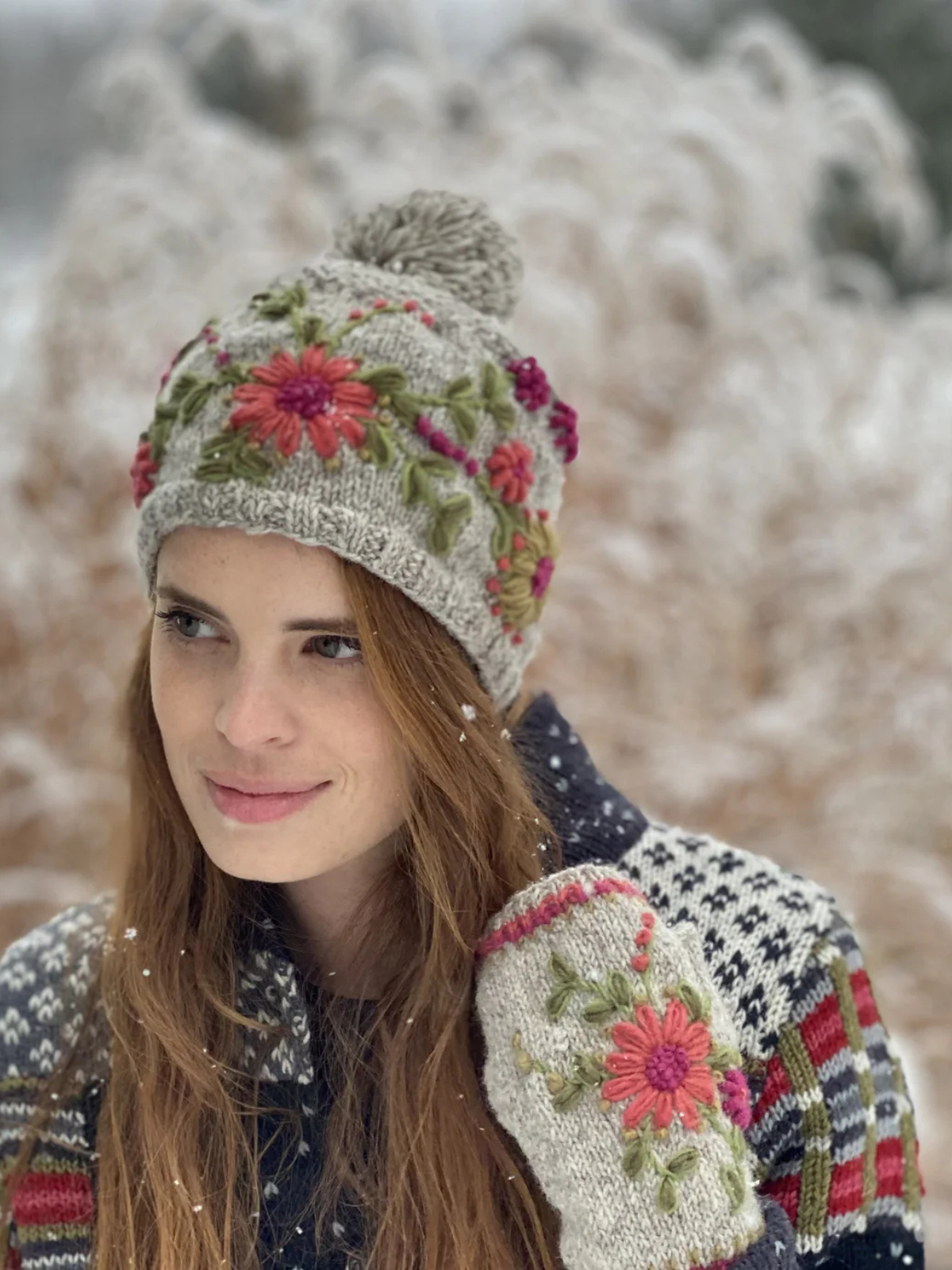 Grey wool knit hat with pompom and pink flower embroidery